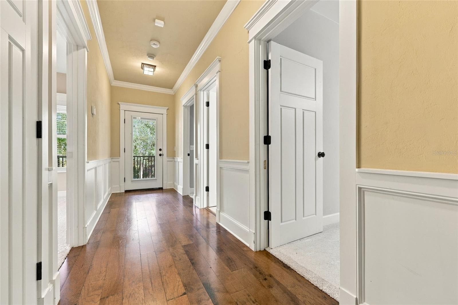 Upstairs hallway to second floor covered porch and three bedrooms. - 734 SW 134TH WAY, NEWBERRY