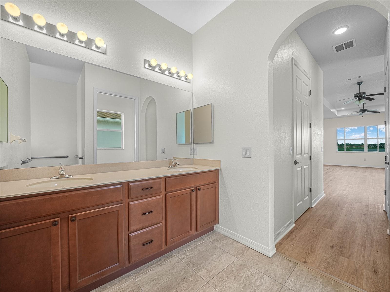 Double Sink Vanity in Primary Bath - 6136 PEBBLE BEACH BLVD, WINTER HAVEN