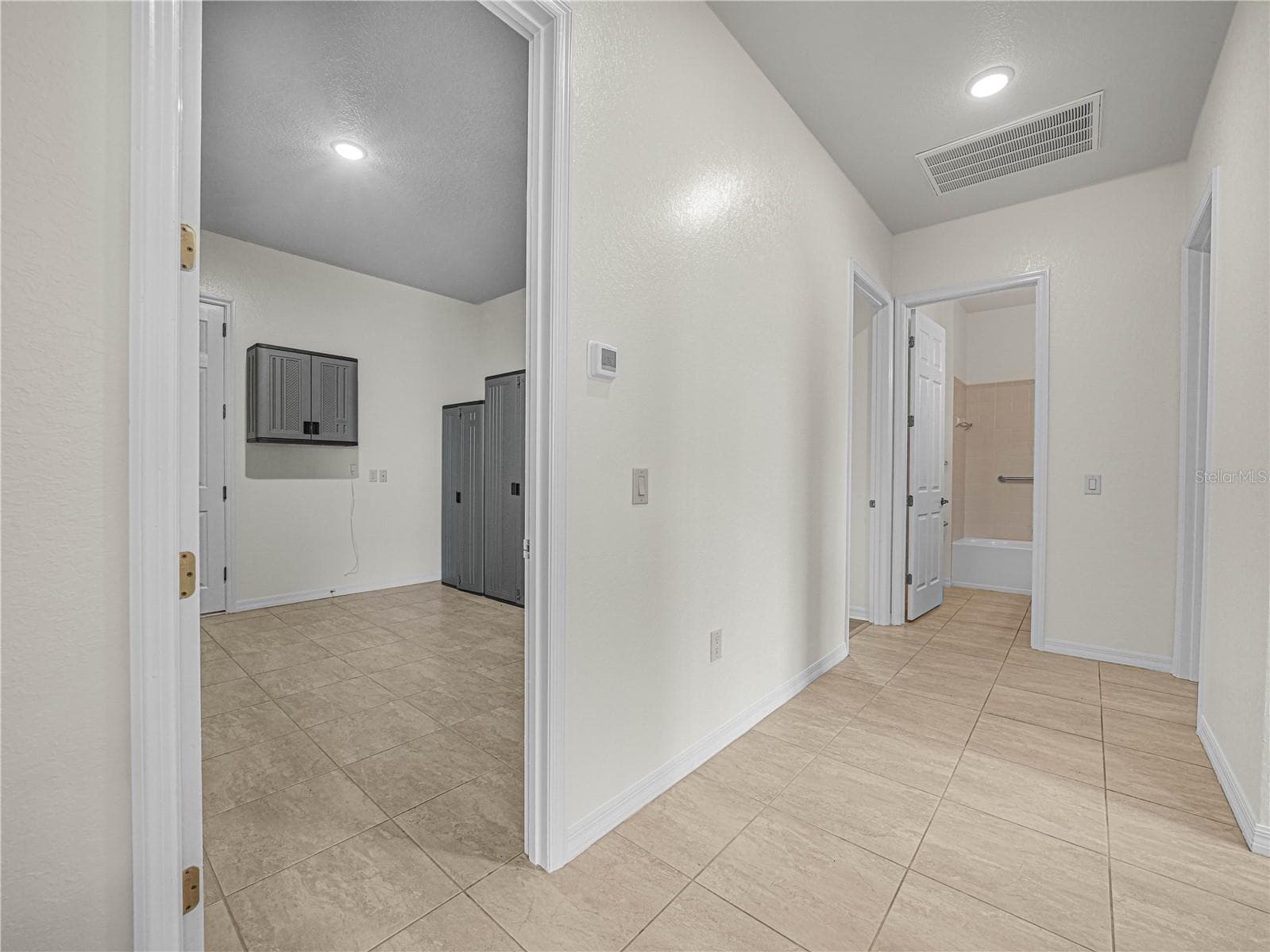 Hallway from LR to Laundry Room and BR 3 and 2nd Suite. Bath 3 - 6136 PEBBLE BEACH BLVD, WINTER HAVEN