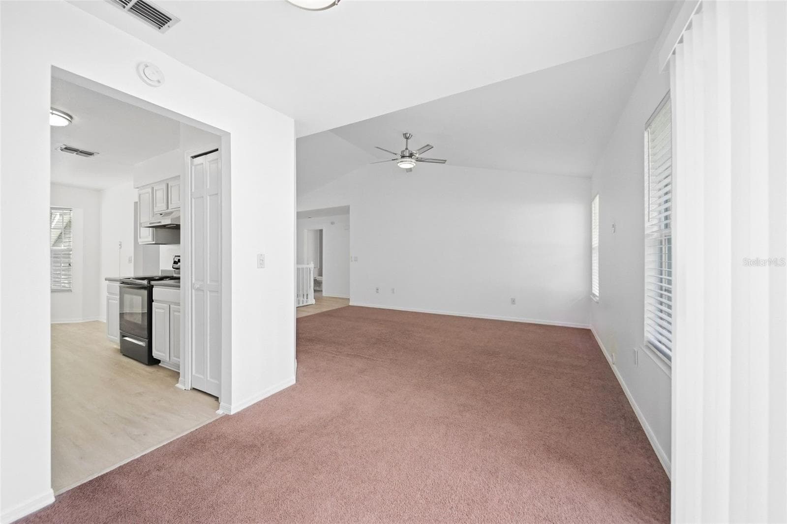 Entry to kitchen and living room space - 2210 COACH HOUSE BLVD #408, ORLANDO