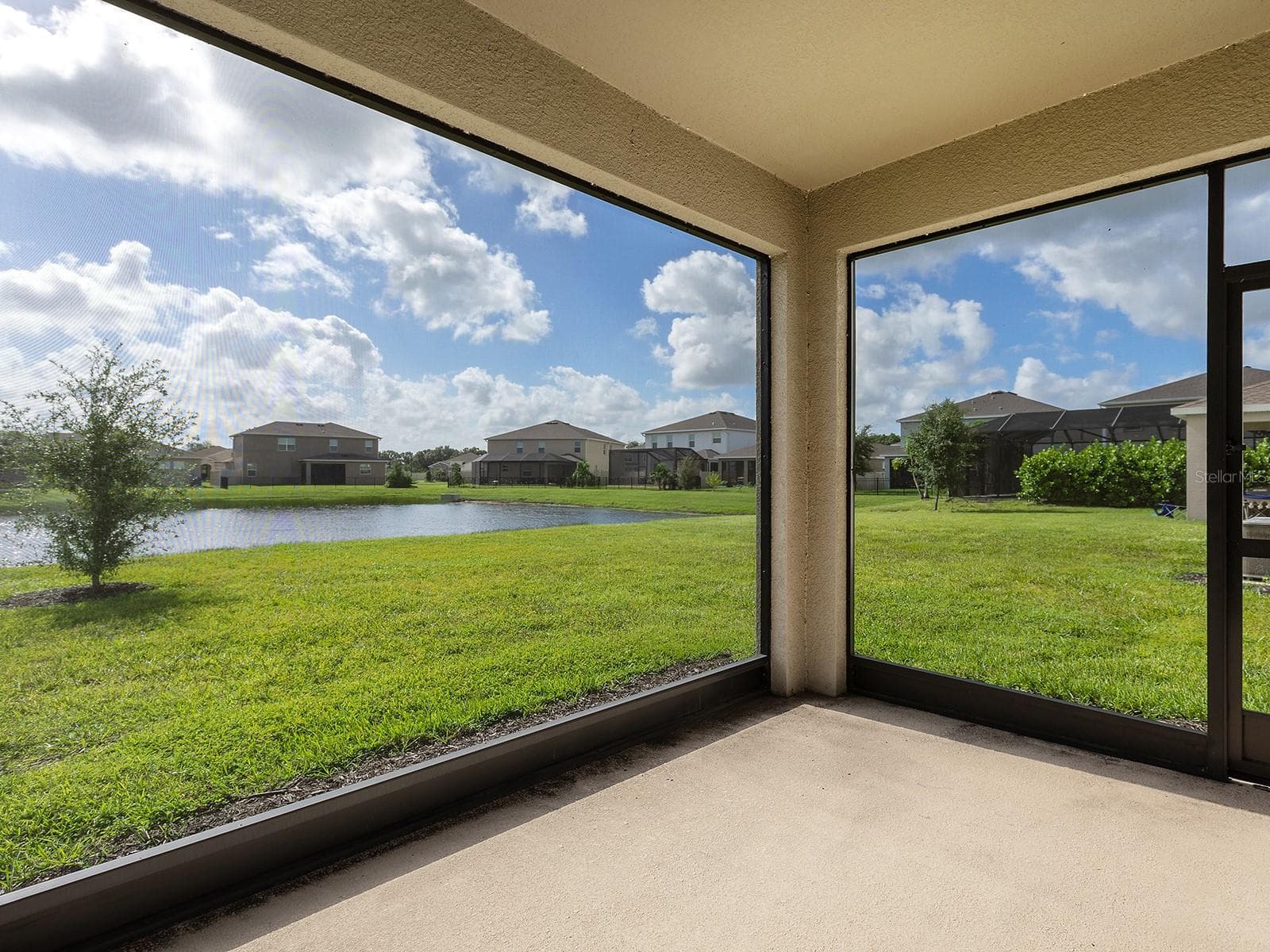 screened lanai with lake views - 5211 TANNIN LN, BRADENTON