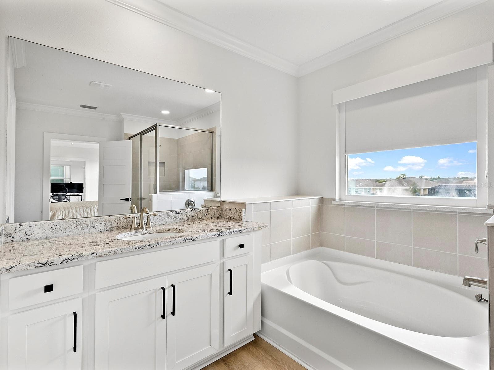 Tub and separate shower on second floor primary bath - 5211 TANNIN LN, BRADENTON