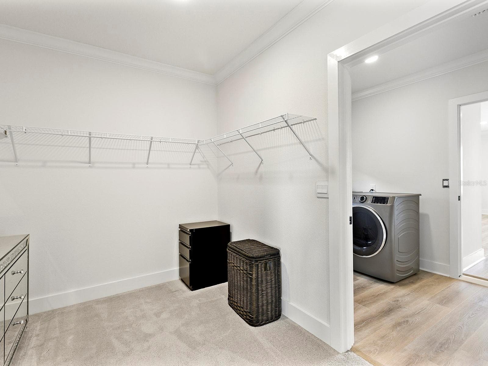 laundry room off the primary walk-in closet - 5211 TANNIN LN, BRADENTON