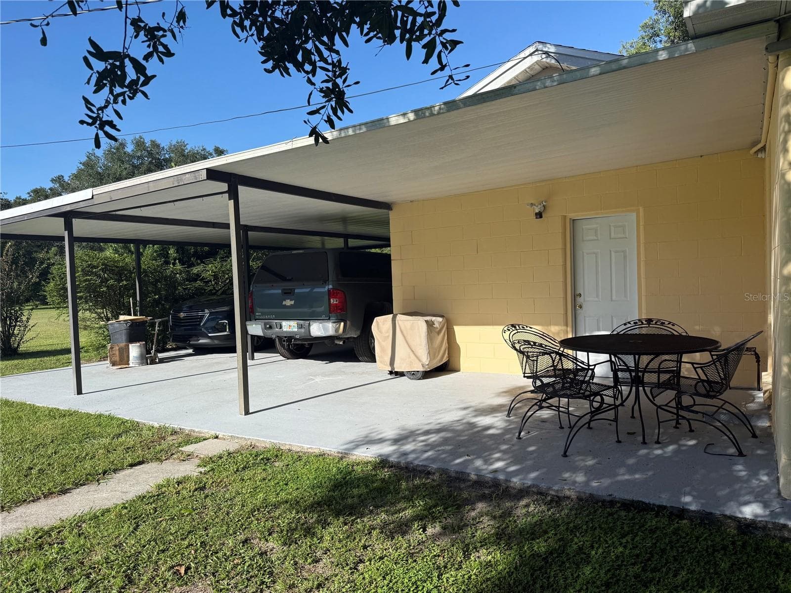 back lanai with 2 carport - 380 MOALE RD, BROOKSVILLE