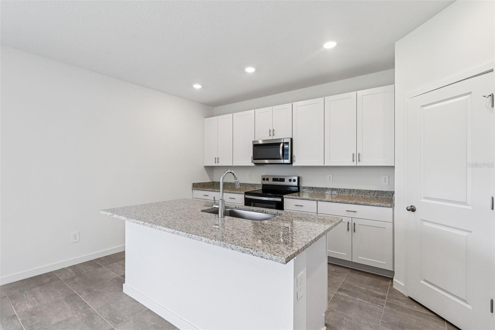 The interior photos are of another home with the same floor plan but different interior color package finishes. Some details may vary - 89 WANDERING CREEK WAY, PALM COAST
