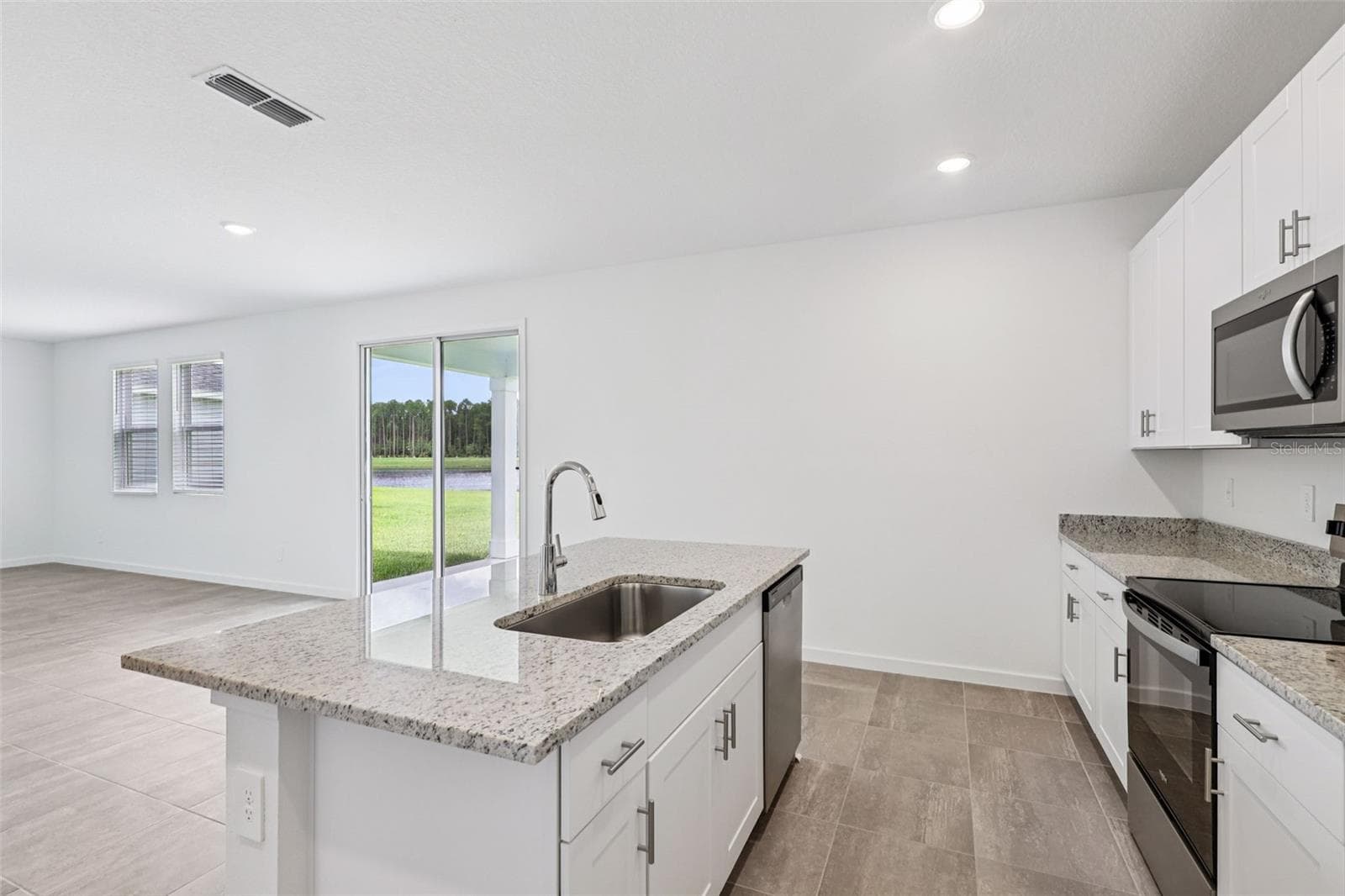 The interior photos are of another home with the same floor plan but different interior color package finishes. Some details may vary - 89 WANDERING CREEK WAY, PALM COAST