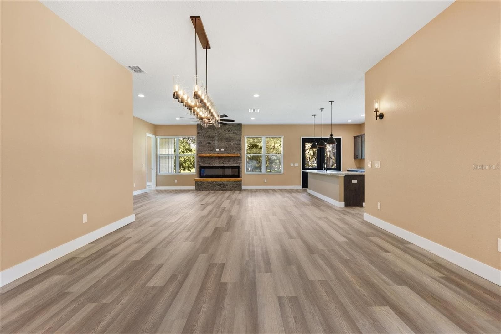 Dining into Great Room and Kitchen - 2540 NE 77TH RD, WILDWOOD