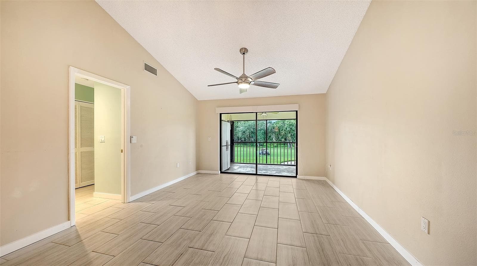 Living Room with lovely view out to Palm-Aire Golf Course! - 7652 EAGLE CREEK DR #7598, SARASOTA