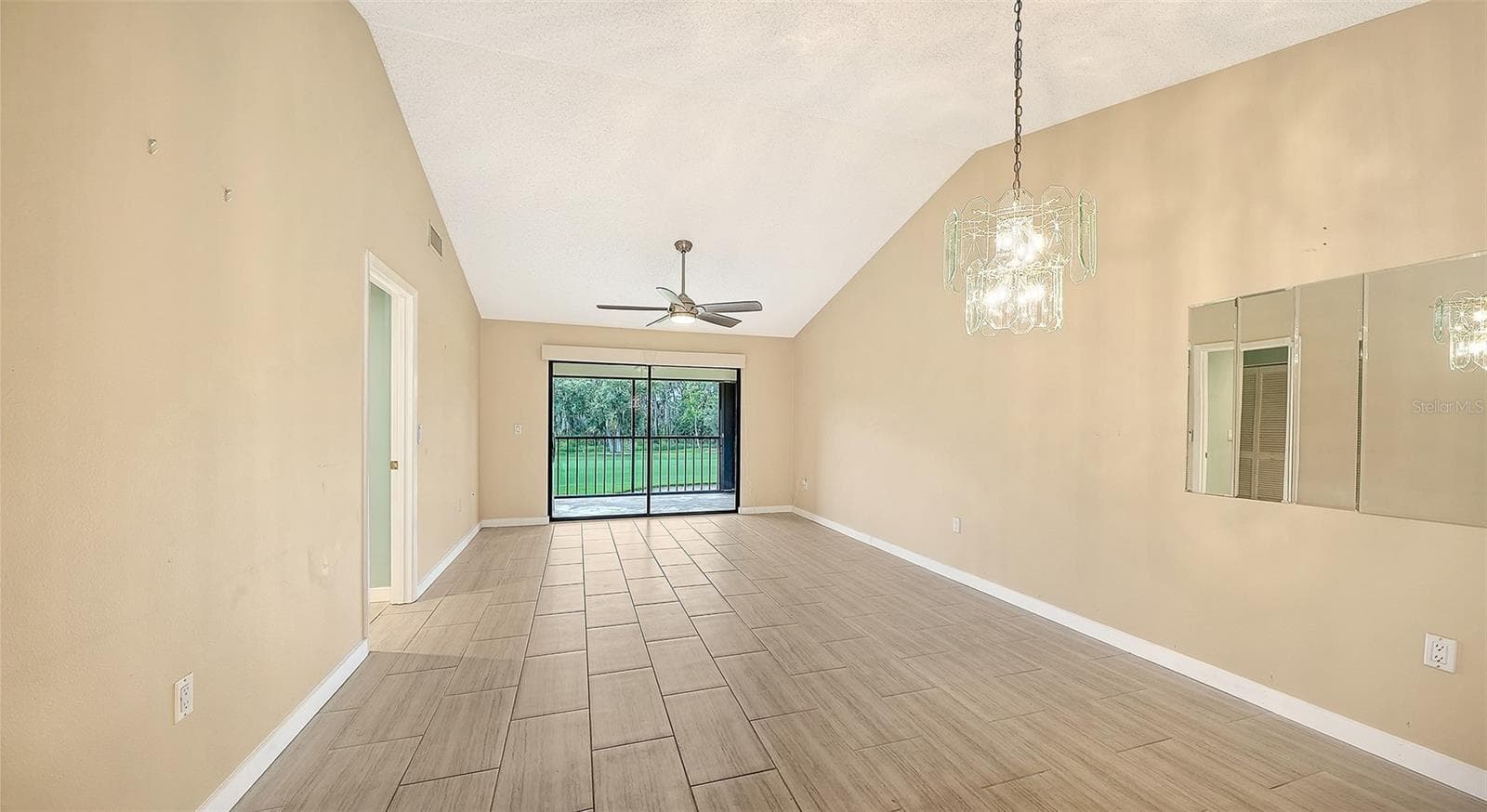 Dining Room and Living Room Combination floor plan style. - 7652 EAGLE CREEK DR #7598, SARASOTA