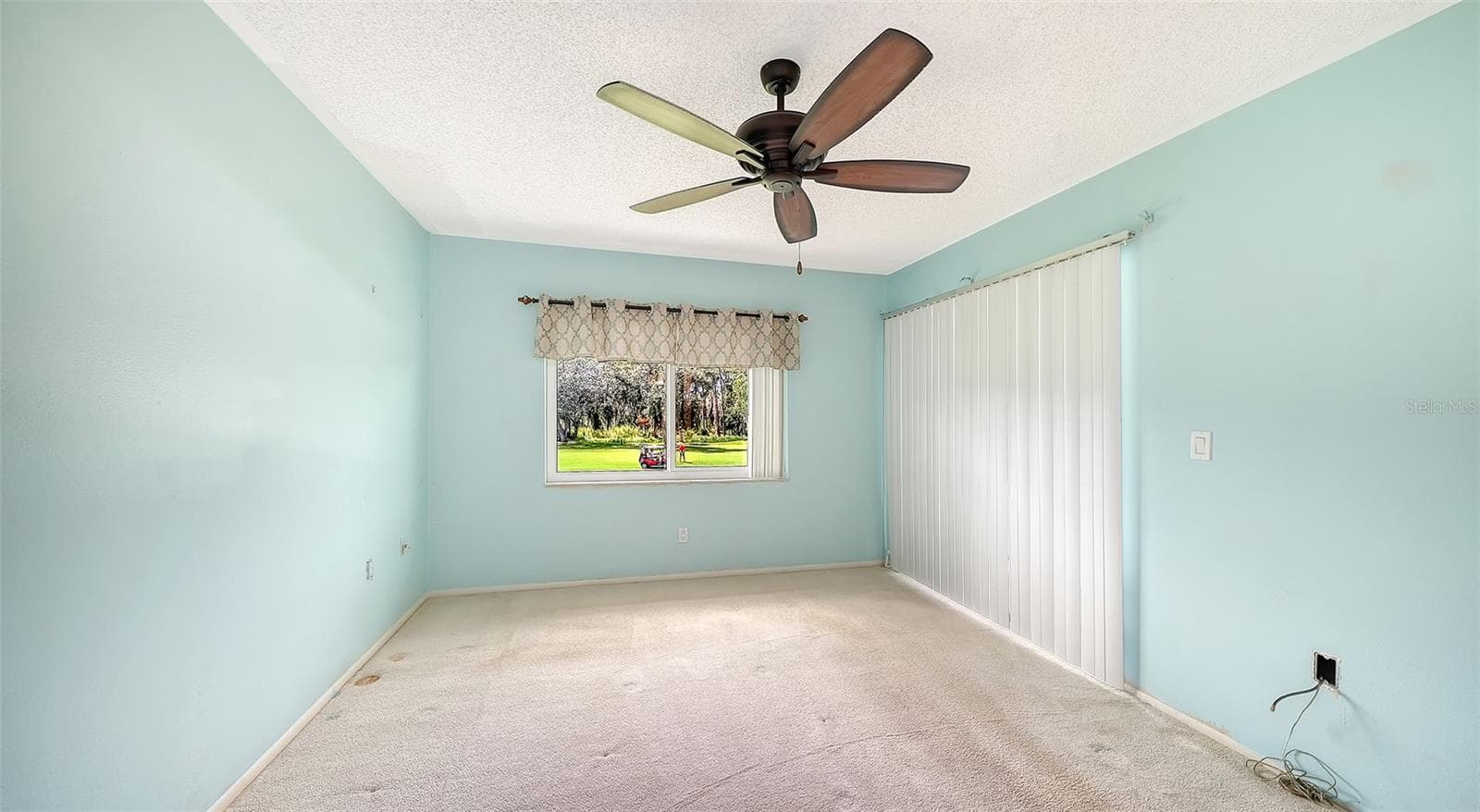 Primary Bedroom with Sliding Glass Doors leading out to your lovely screened Lanai! - 7652 EAGLE CREEK DR #7598, SARASOTA