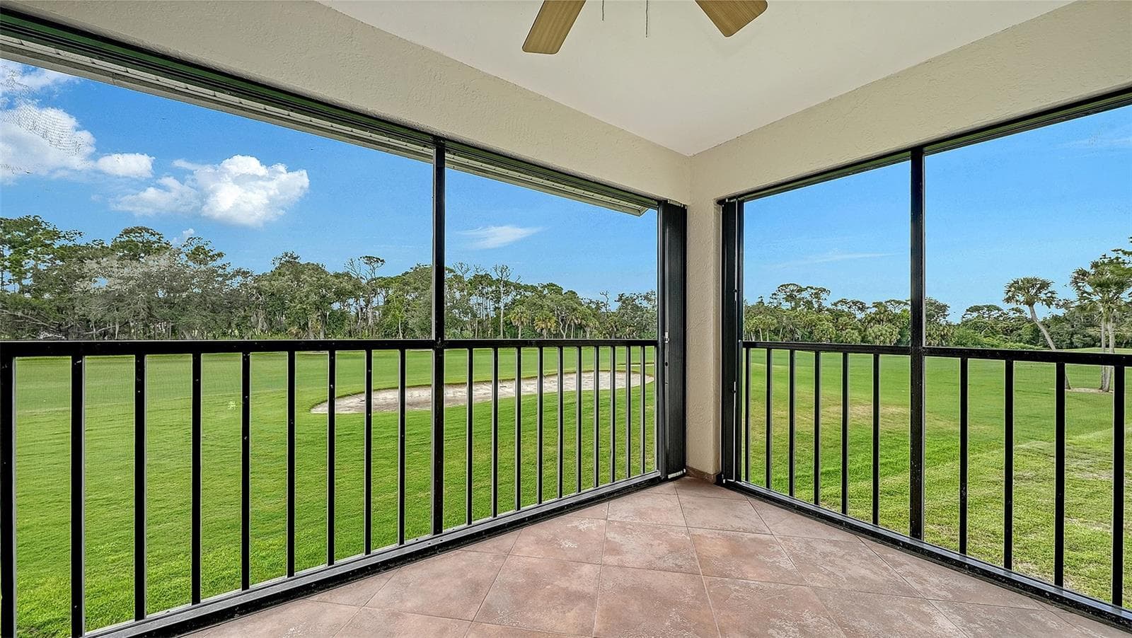 Generous sized screened Lanai overlooking the golf course with manual sliding hurricane shutters! - 7652 EAGLE CREEK DR #7598, SARASOTA