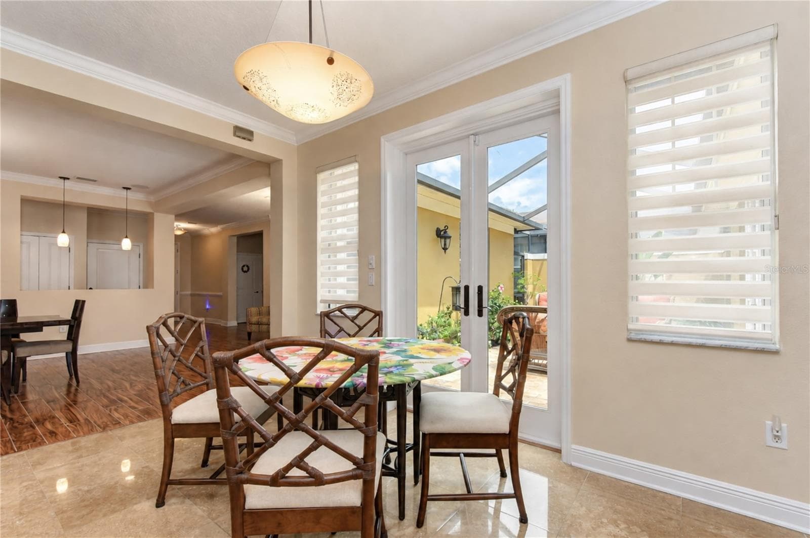 Eat-in breakfast nook with French doors leading to lanai - 6806 MUNCASTER CT, TAMPA
