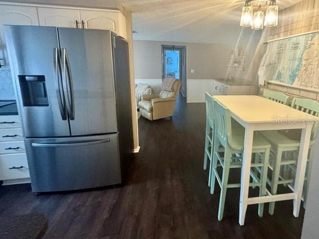 View from dining room into kitchen, bonus room and hall to 2nd bedroom/bathroom - 12505 STAGECOACH LN, HUDSON
