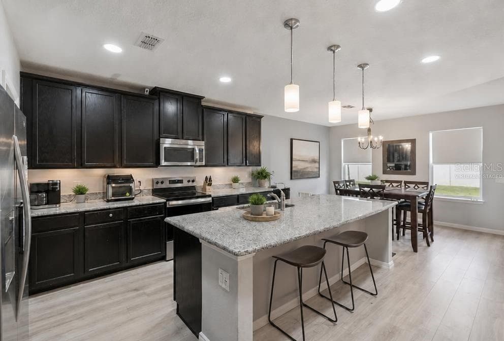 Virtually Staged Kitchen and Dining - 2815 MONTICELLO WAY, KISSIMMEE