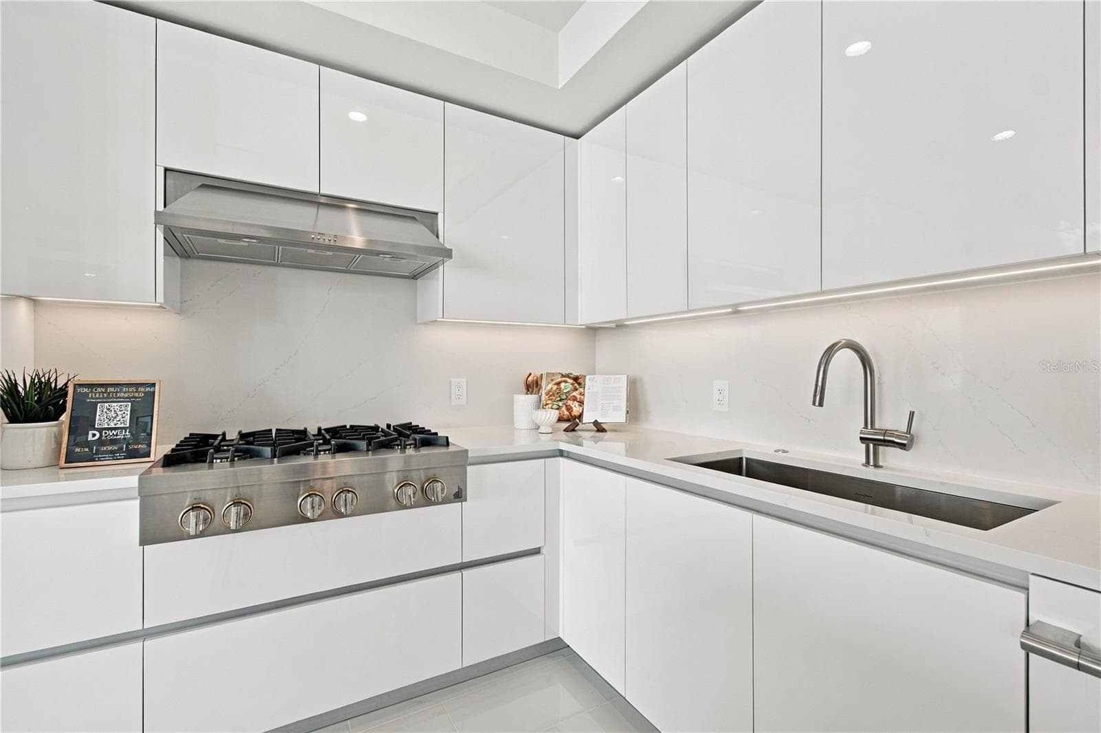 JennAir appliances and custom integrated cabinetry create a clean, contemporary kitchen - 400 CENTRAL AVE #2505, ST PETERSBURG