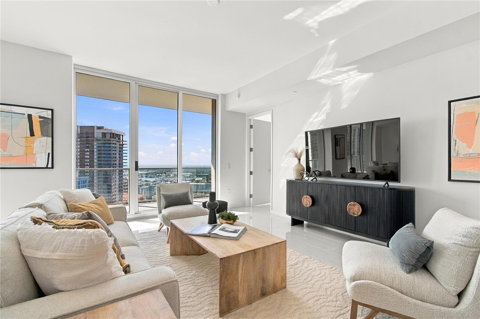 Floor-to-ceiling glass fills the great room with natural light while framing panoramic views - 400 CENTRAL AVE #2505, ST PETERSBURG