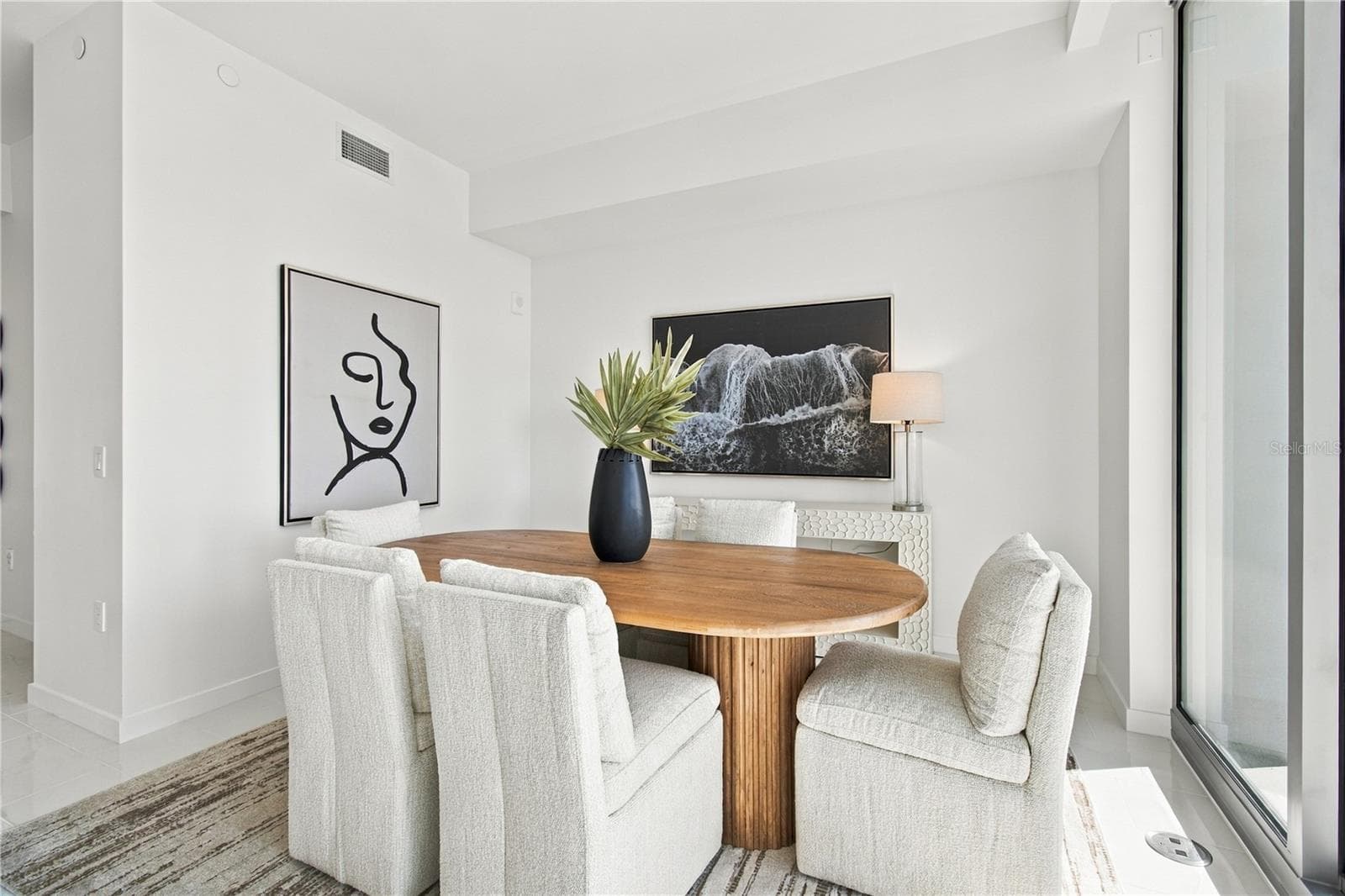 Professionally staged dining area demonstrates the flexibility of the expansive great room - 400 CENTRAL AVE #2505, ST PETERSBURG