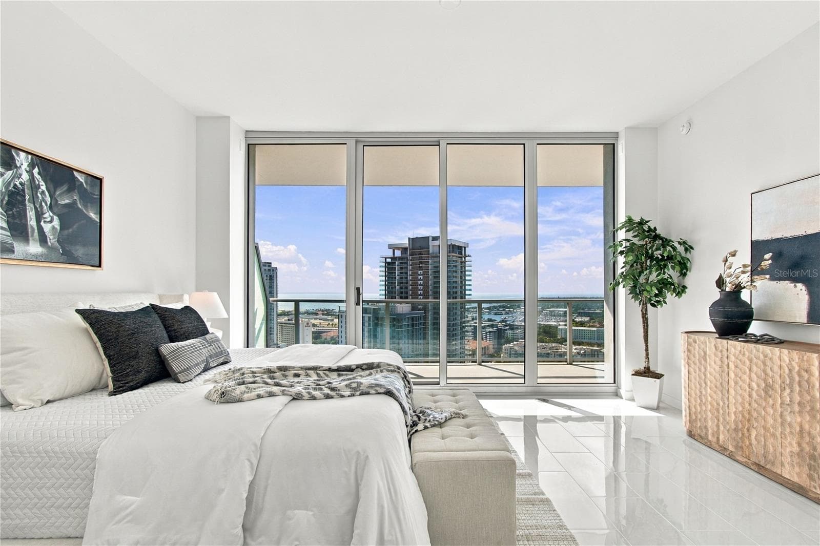 Primary suite features floor-to-ceiling glass, terrace access and sweeping 25th-floor views - 400 CENTRAL AVE #2505, ST PETERSBURG