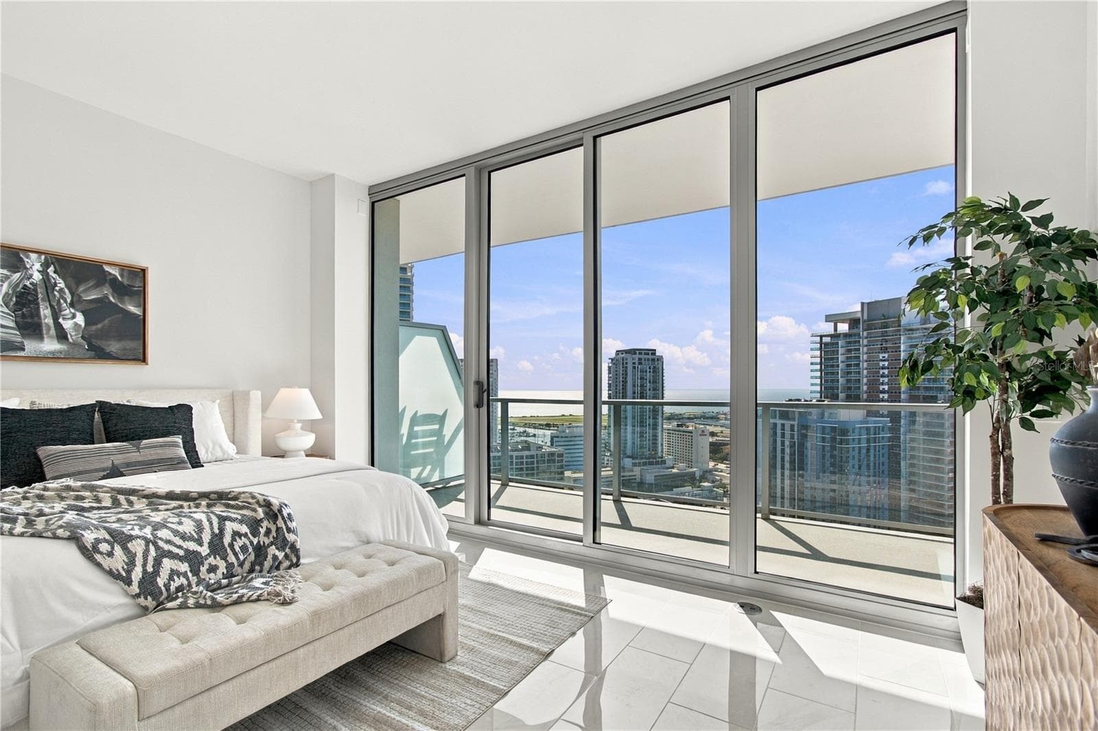 Wake to panoramic city and water views from the spacious primary suite - 400 CENTRAL AVE #2505, ST PETERSBURG