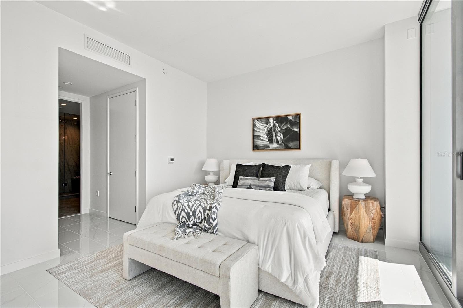 Primary bedroom offers generous proportions and direct access to the full-length terrace - 400 CENTRAL AVE #2505, ST PETERSBURG