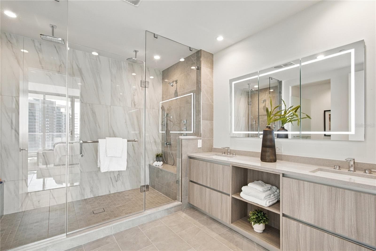 Spa-inspired primary bath features a spectacular custom 9-foot walk-in shower - 400 CENTRAL AVE #2505, ST PETERSBURG