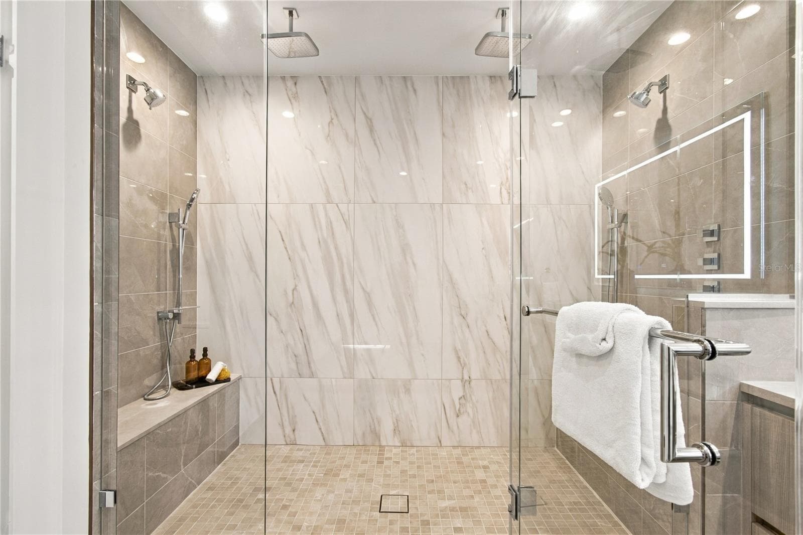 9-foot shower features dual rain heads, wall-mounted shower systems and handheld sprays at each end - 400 CENTRAL AVE #2505, ST PETERSBURG
