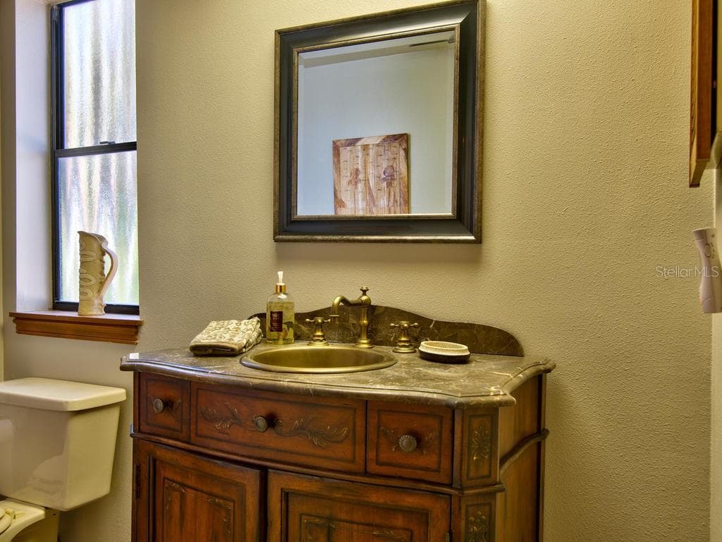 Half bath on main floor - 2700 GULF BLVD #2, INDIAN ROCKS BEACH