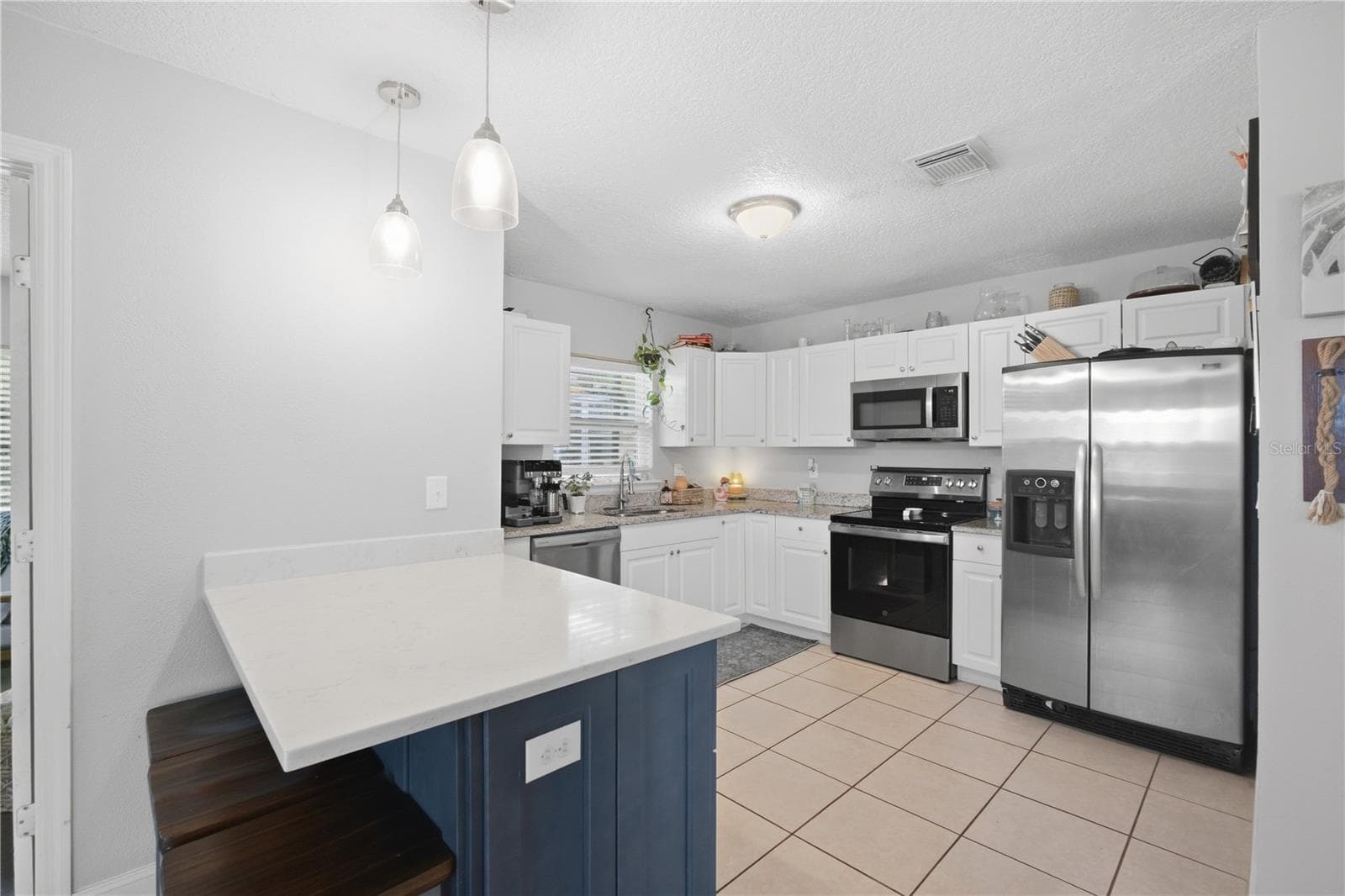 View of the kitchen with plenty of cabinets. - 345 CANNON ST, LAKELAND