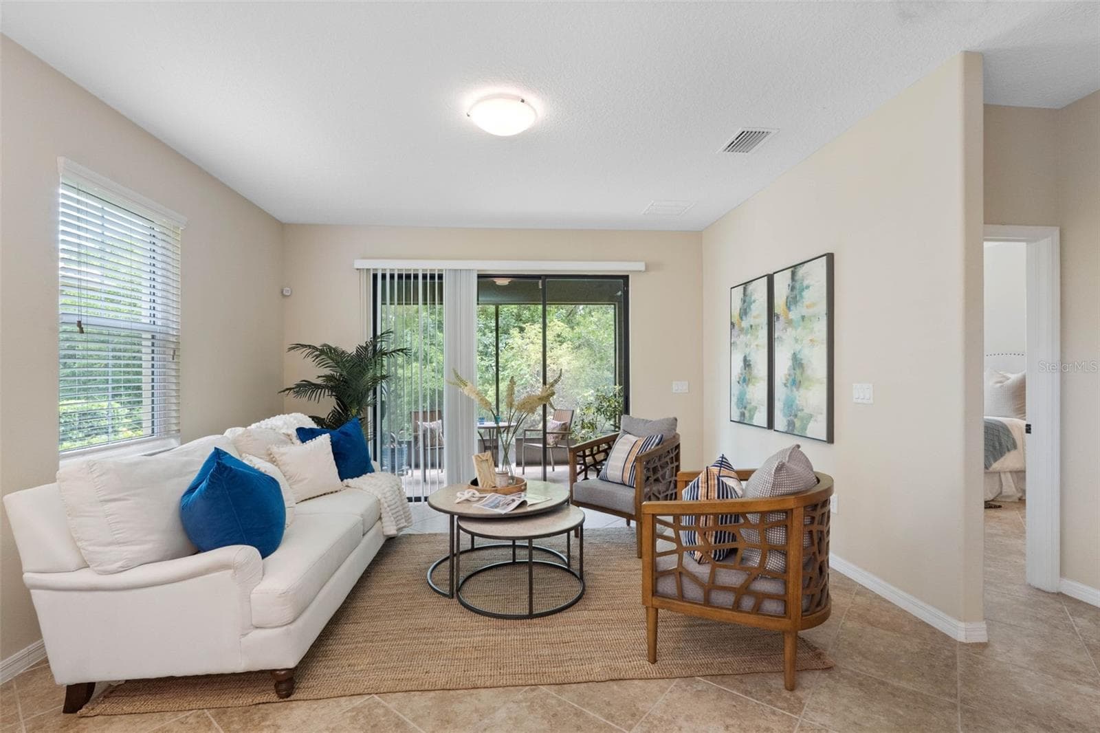 Living room and screened in patio - 7949 TASSO CT, SEMINOLE