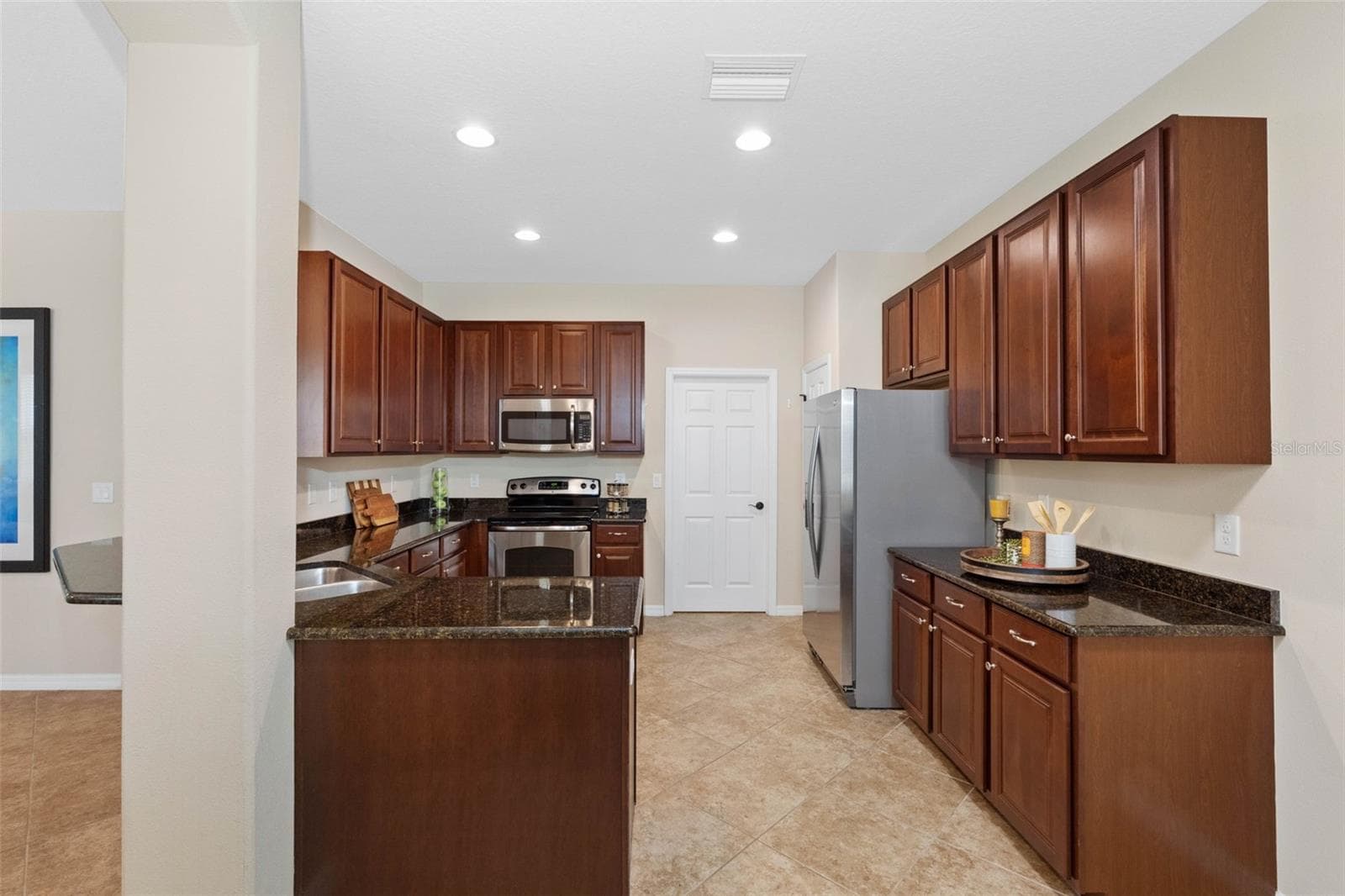 Laundry room located off of the kitchen - 7949 TASSO CT, SEMINOLE