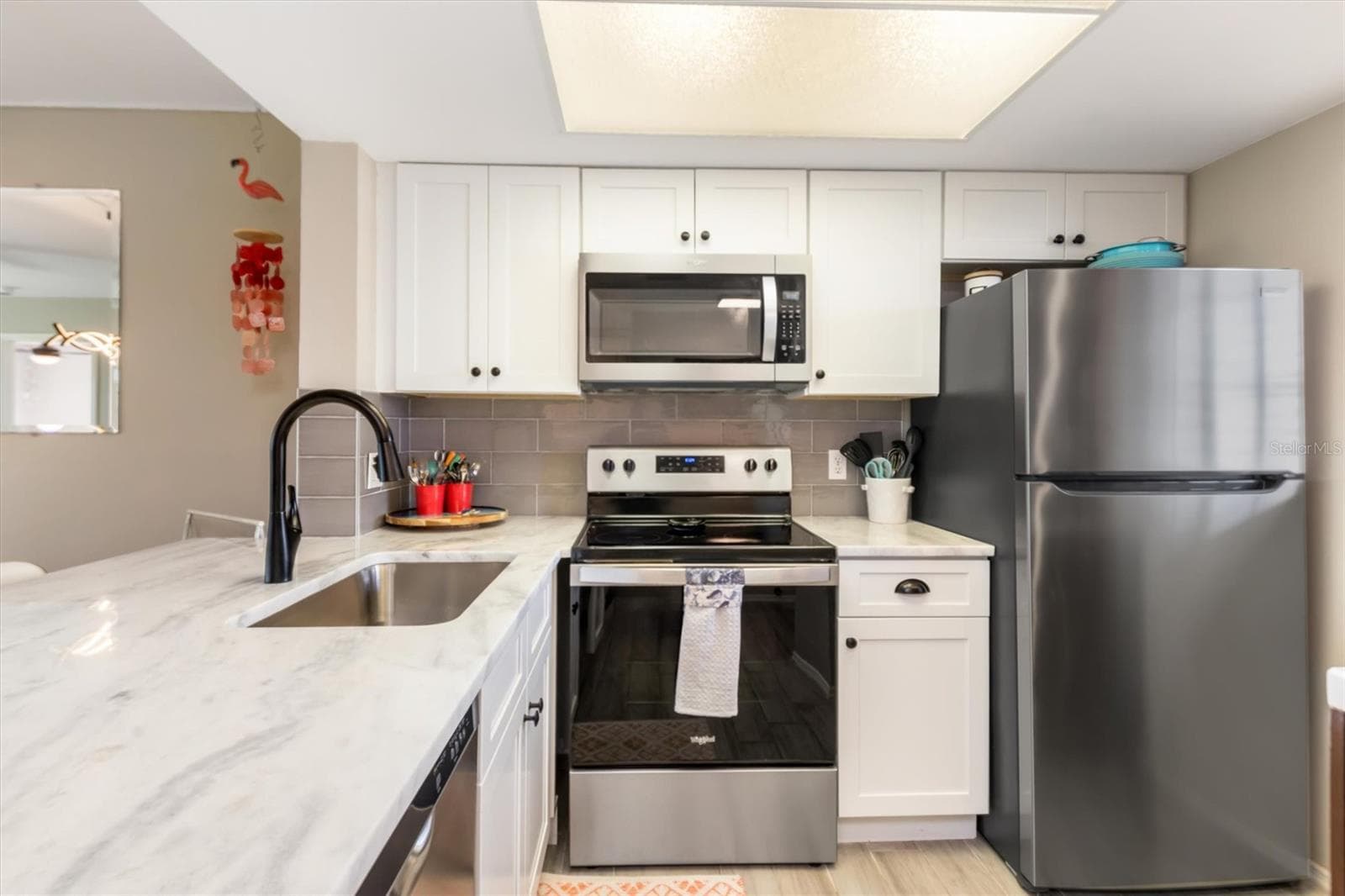 STAINLESS APPLIANCE SUITE AND TOP TIER GRANITE - 3310 LOVELAND BLVD #1105, PUNTA GORDA
