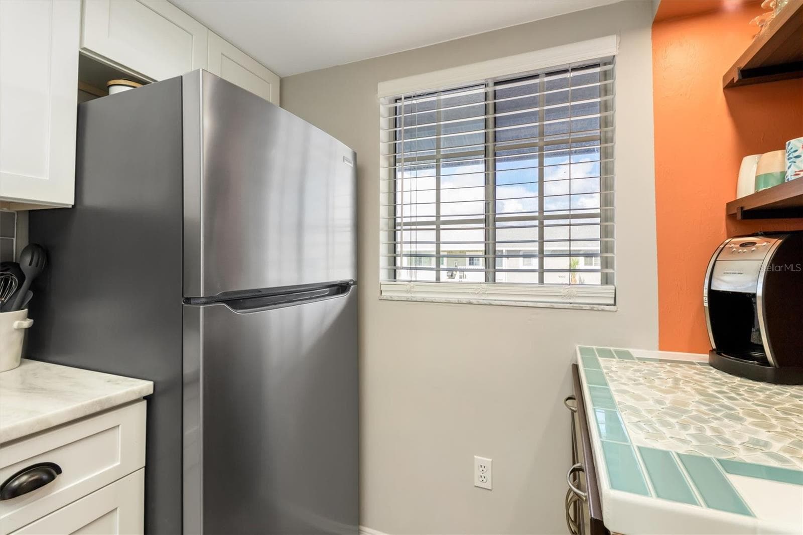 COFFEE /BEVERAGE BAR WITH SEA GLASS TILE - 3310 LOVELAND BLVD #1105, PUNTA GORDA