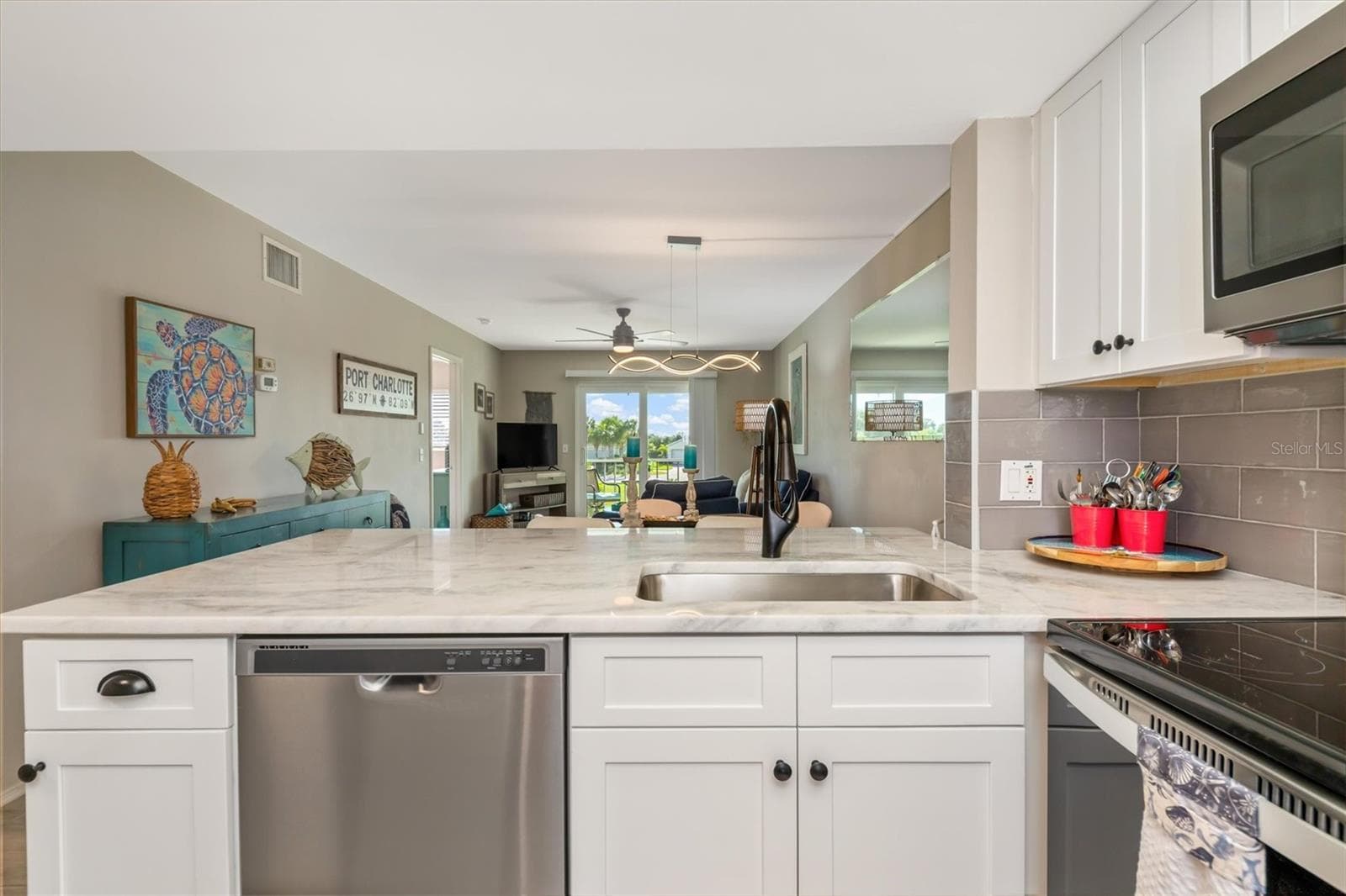 SOFT CLOSE SOLID WOOD CABINETS AND ON TREND HARDWARE - 3310 LOVELAND BLVD #1105, PUNTA GORDA