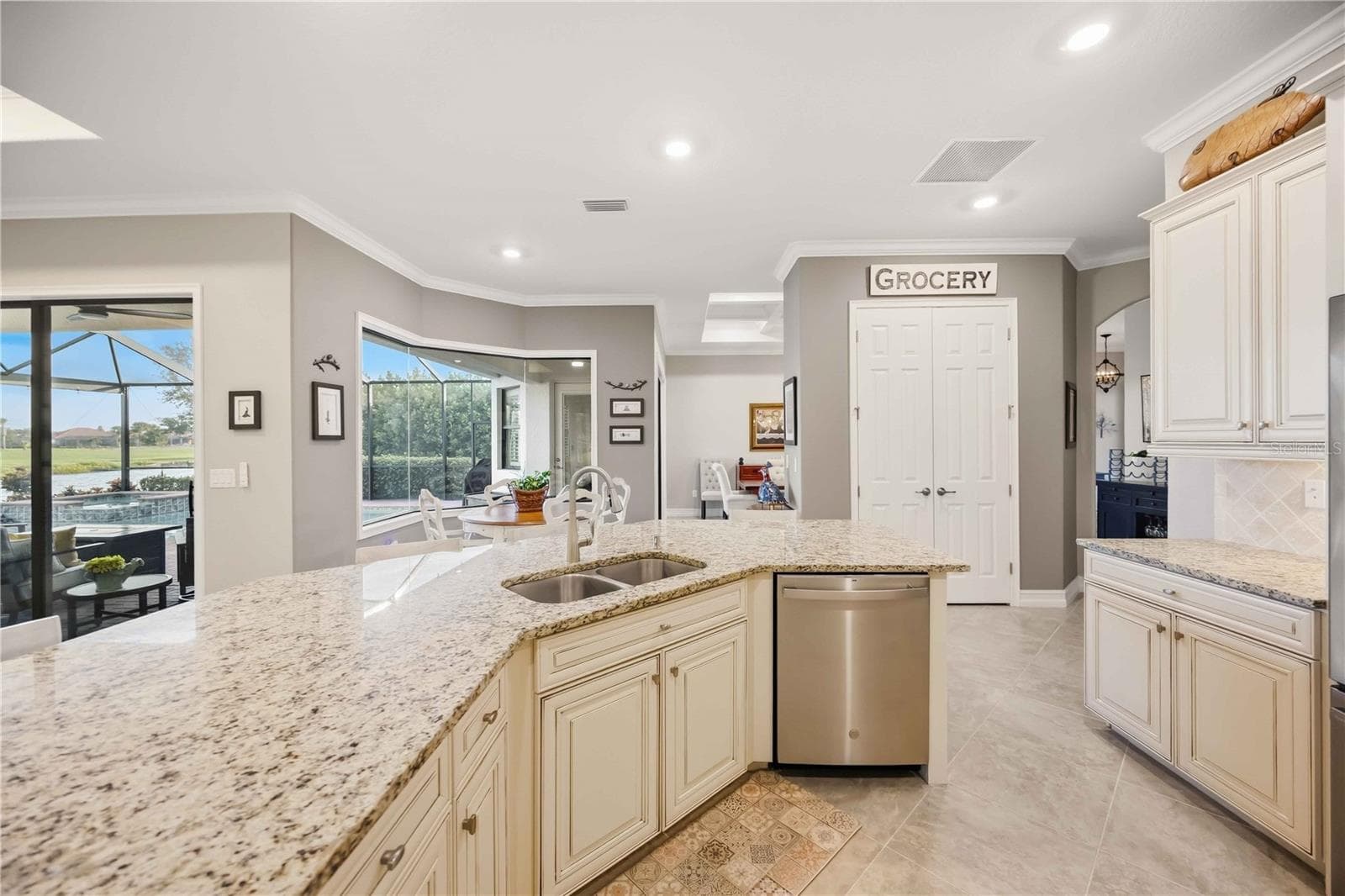 Upscale Kitchen with double ovens, dishwasher, cooktop, plenty of counter space, and dining on the counter. - 10720 TARFLOWER DR, VENICE
