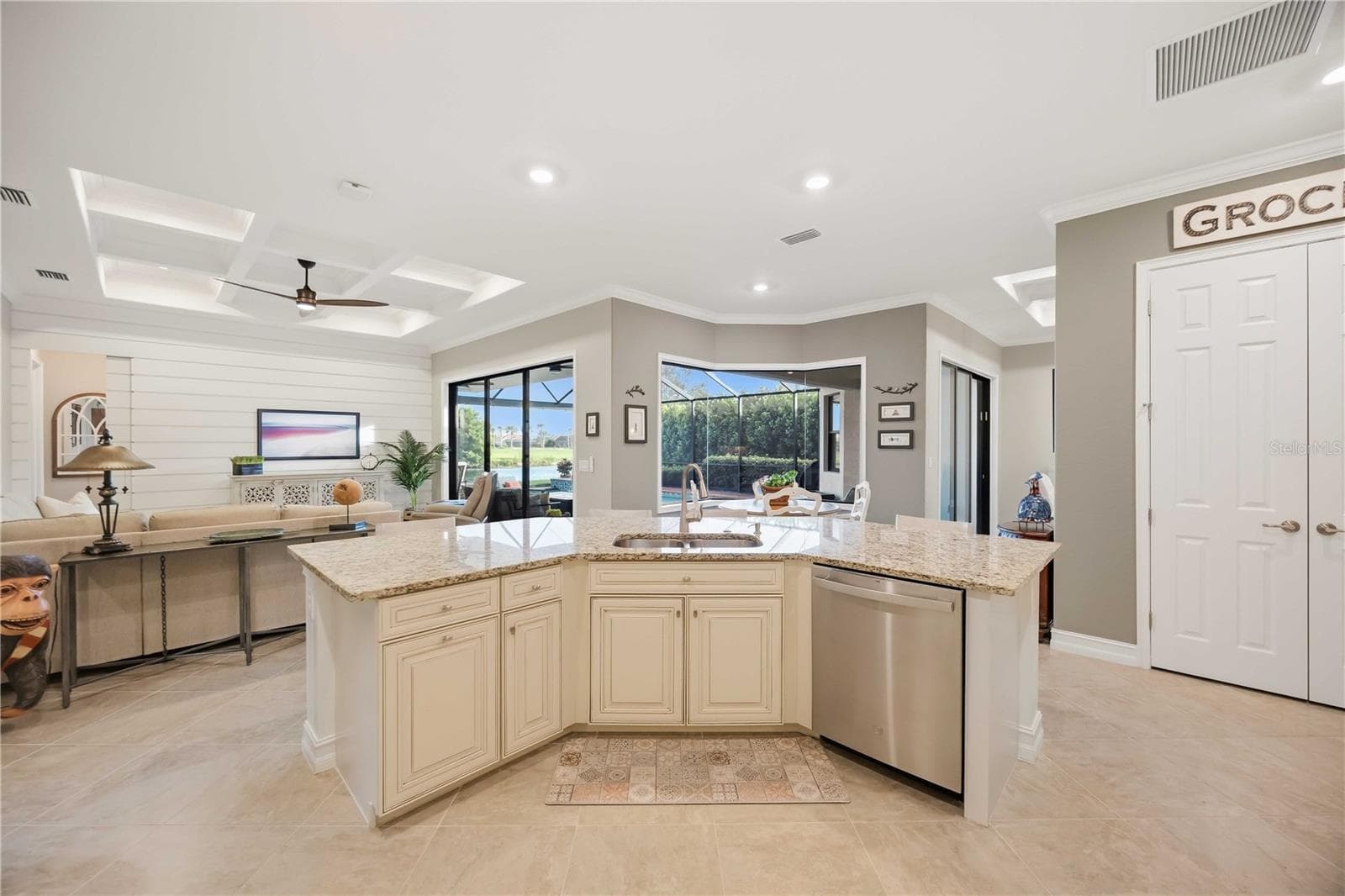 Upscale Kitchen with double ovens, dishwasher, cooktop, plenty of counter space, and dining on the counter. - 10720 TARFLOWER DR, VENICE