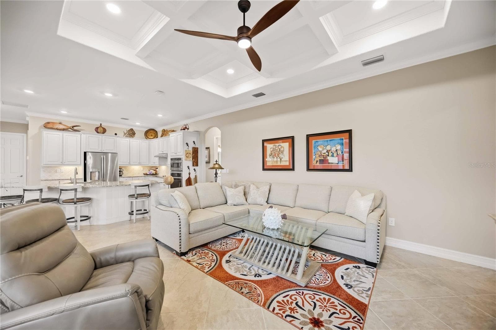 The family room and kitchen blend for effortless entertaining. - 10720 TARFLOWER DR, VENICE