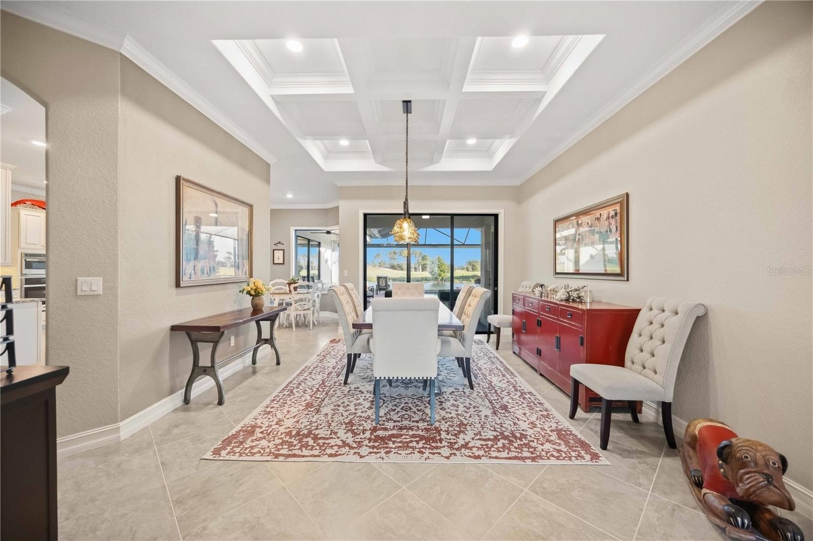 The dining room, grid ceilings, custom millwork throughout the home. - 10720 TARFLOWER DR, VENICE