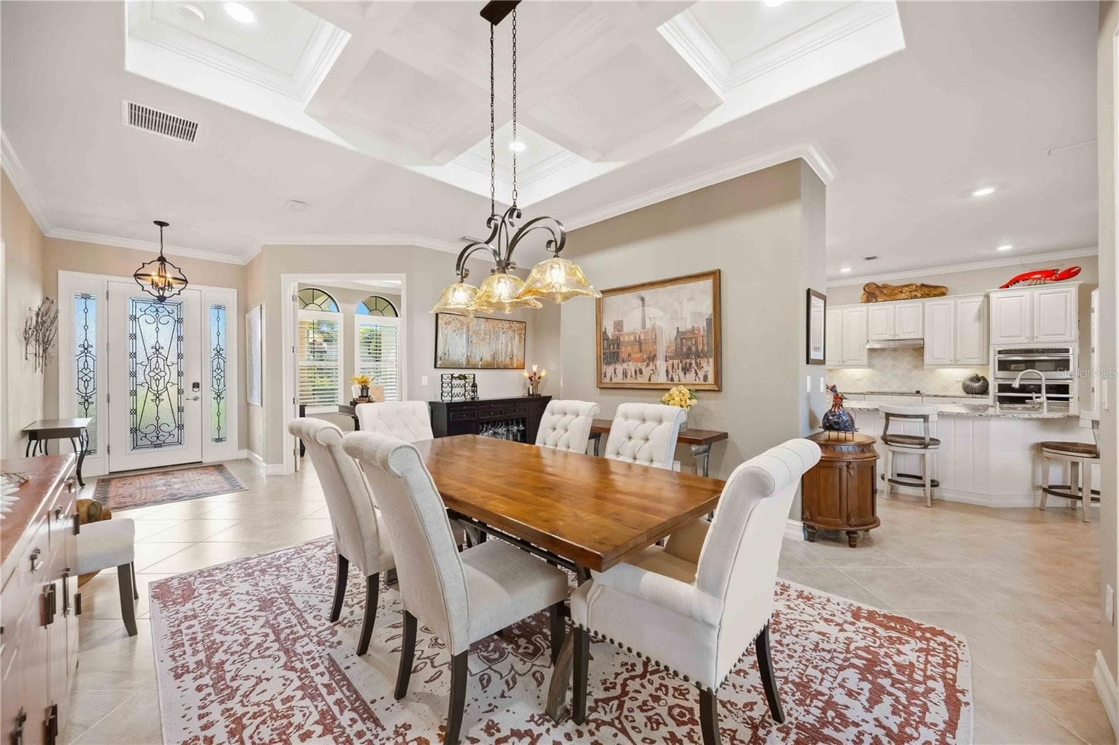 The dining room is the focal point as you enter the home. the owners took the original dining room and made it an office. The living room became the dining room and they removed the wall to open the home. Simply stunning. - 10720 TARFLOWER DR, VENICE