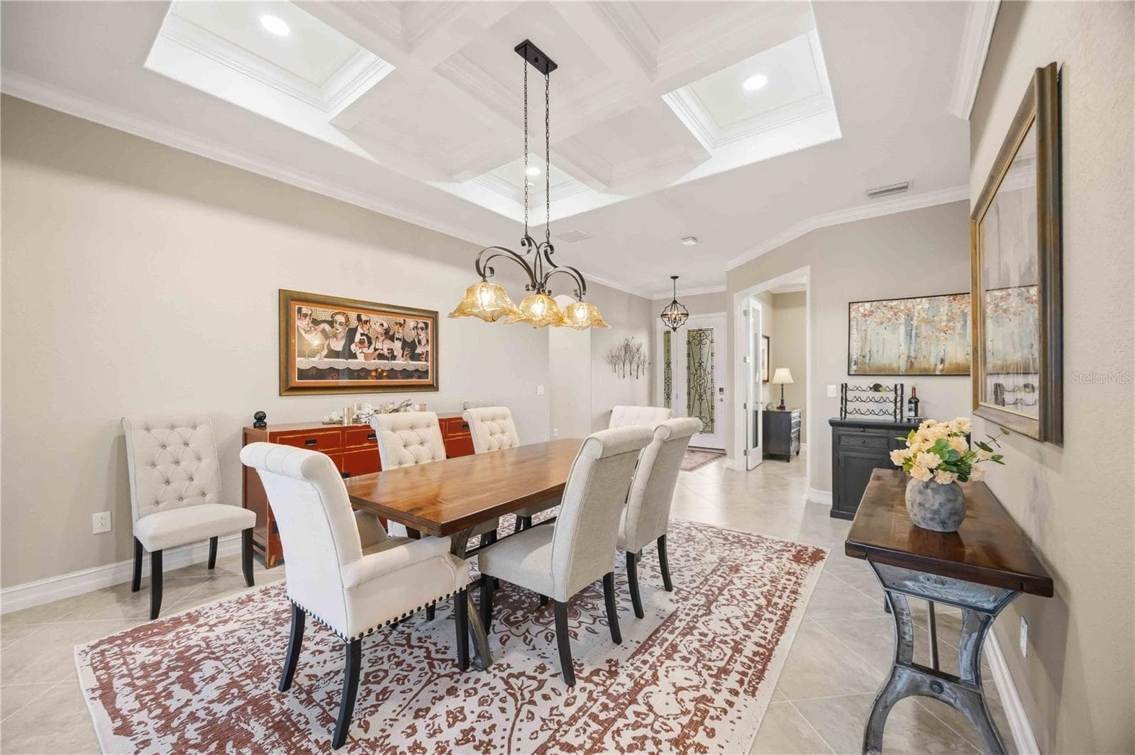 The dining room is the focal point as you enter the home. the owners took the original dining room and made it an office. The living room became the dining room and they removed the wall to open the home. Simply stunning. - 10720 TARFLOWER DR, VENICE