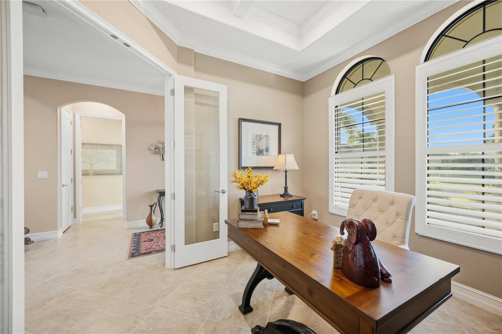 The office is beautiful. Loads of light, plantation shutters throughout, really well done. - 10720 TARFLOWER DR, VENICE