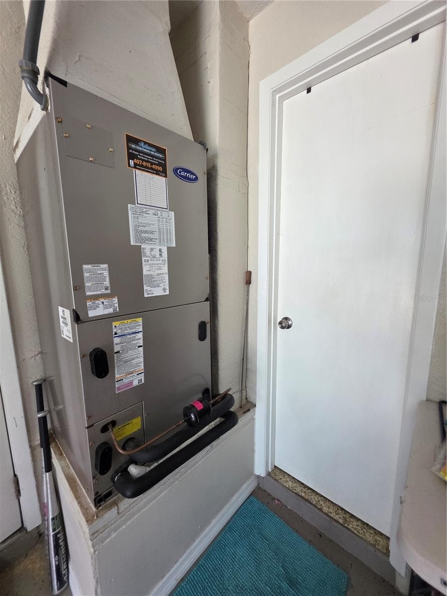 Air handler and entrance to 2nd bathroom in garage. - 1535 URBANA AVENUE, DELTONA