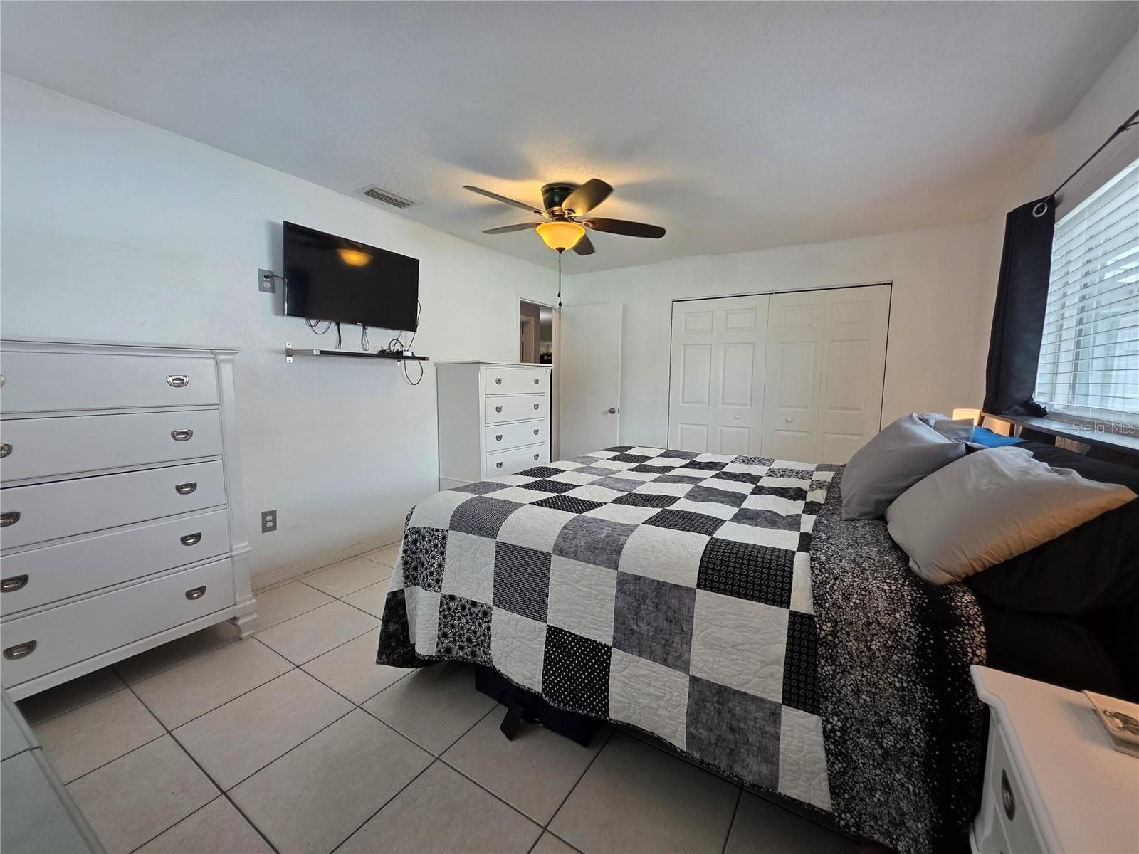 It has a large closet with wire shelving and tiled flooring - 1535 URBANA AVENUE, DELTONA