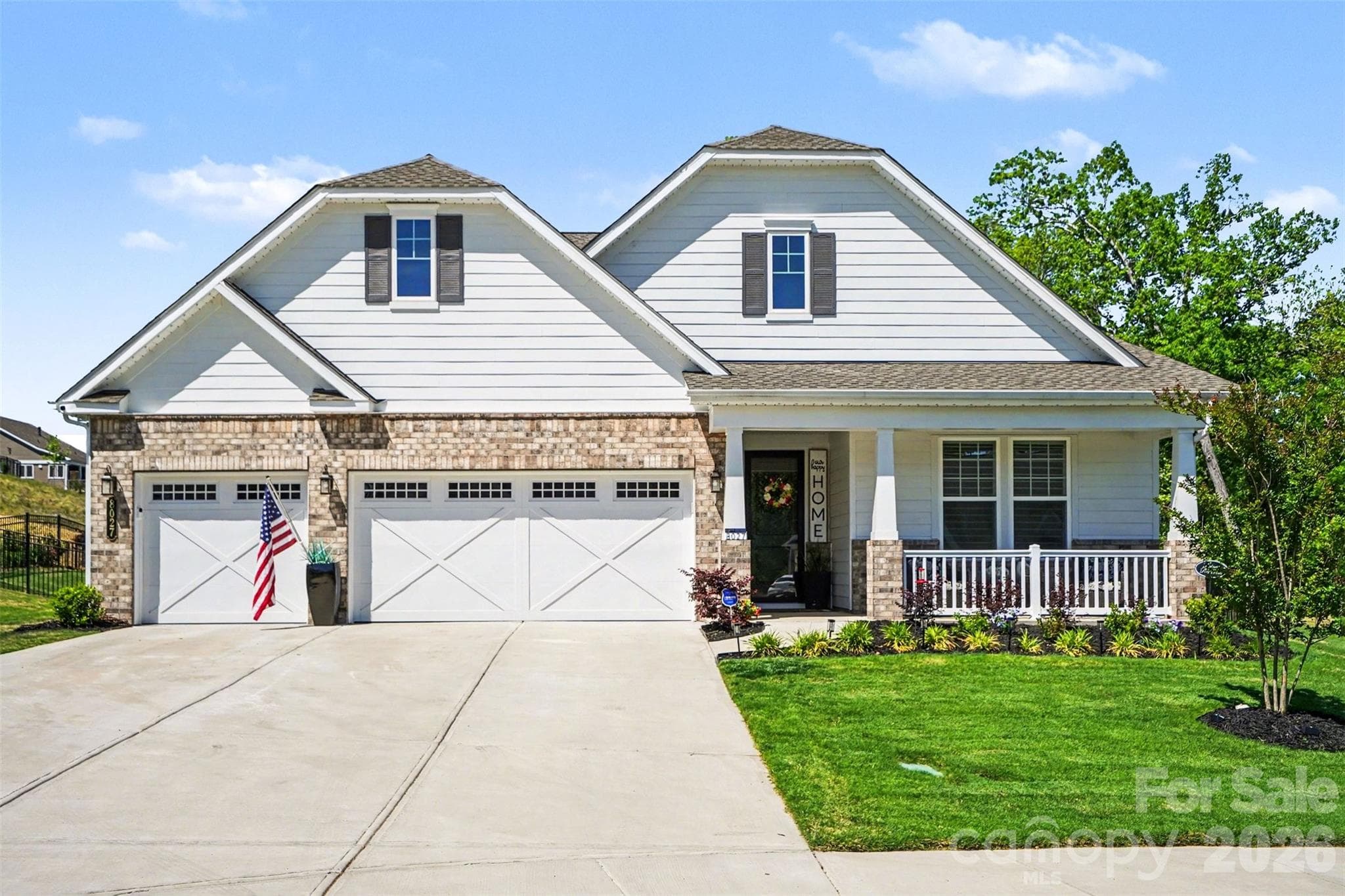 Beautiful in the daylight! Brick and fiber cement siding, with a three-car garage. - 8027 Longwaters Court, York