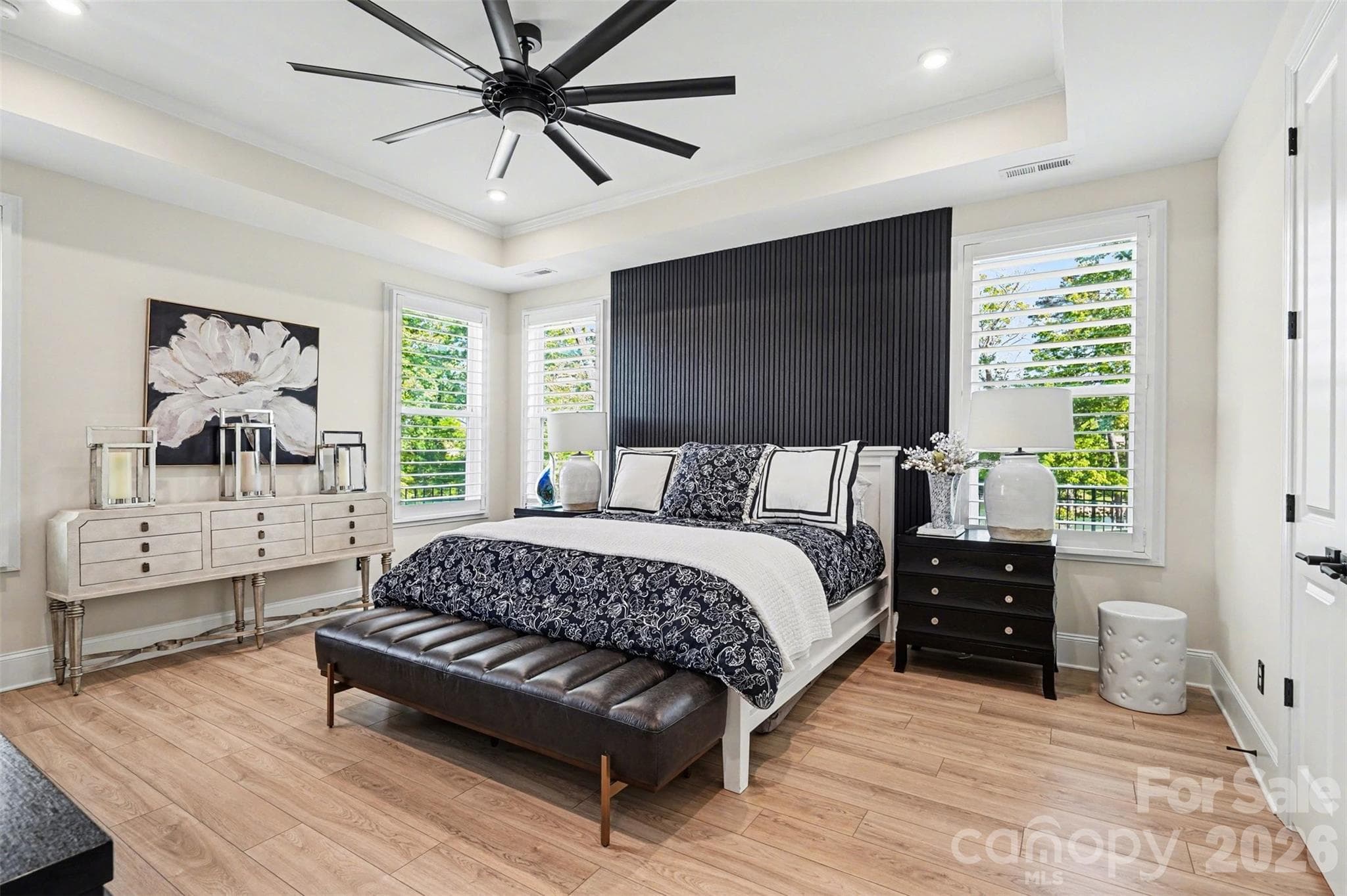 Tray ceiling, accent wall, and windows on two sides. Bright and quiet Primary Suite. - 8027 Longwaters Court, York