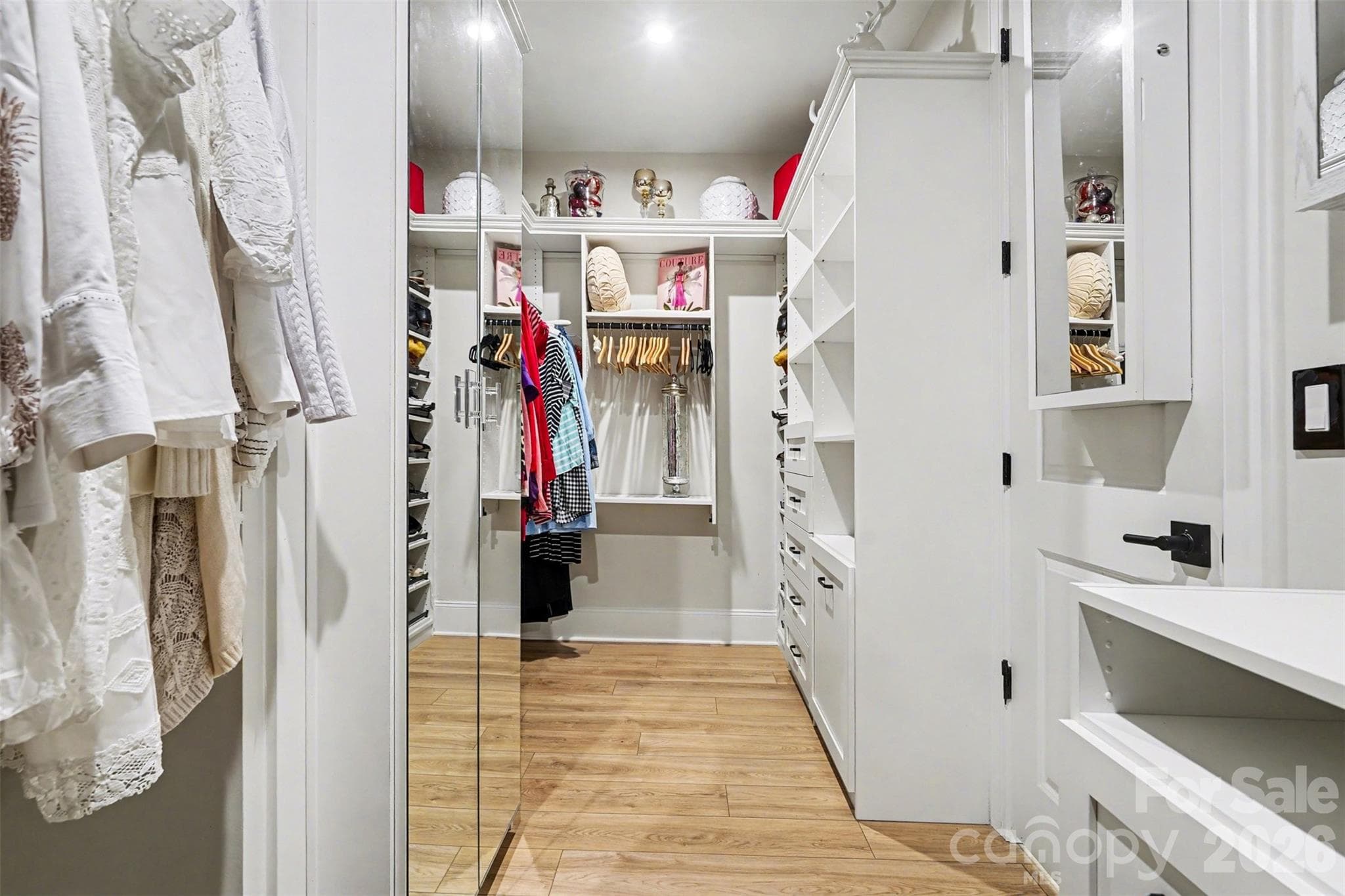 Custom closet with drawers, shoe storage, and a mirror. Everything has a place. - 8027 Longwaters Court, York