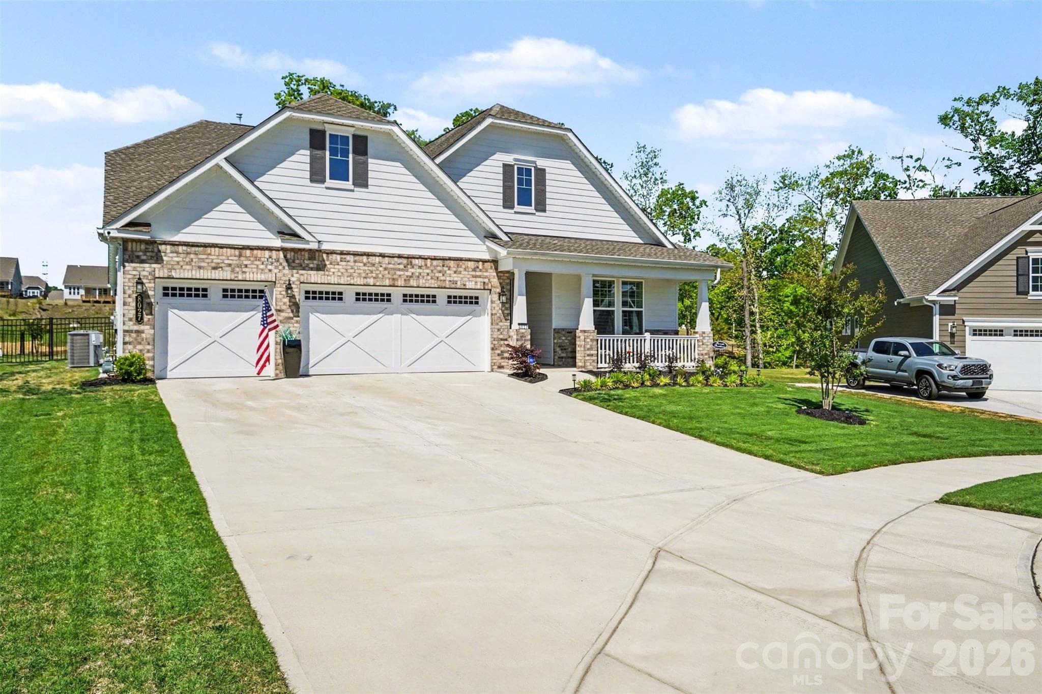 Three-car garage and an expansive driveway, so parking is never a problem. - 8027 Longwaters Court, York