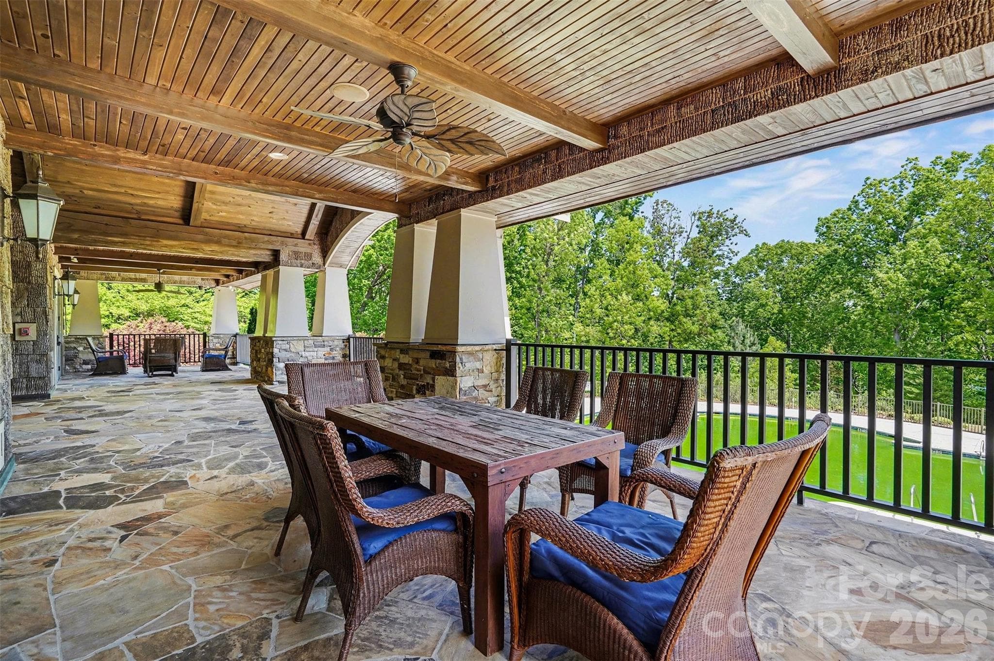 Meet up with friends on the clubhouse porch. It's shaded and breezy, with plenty of room to spread out. Having an event at the clubhouse? This is where the party spills out to enjoy the view. - 8027 Longwaters Court, York