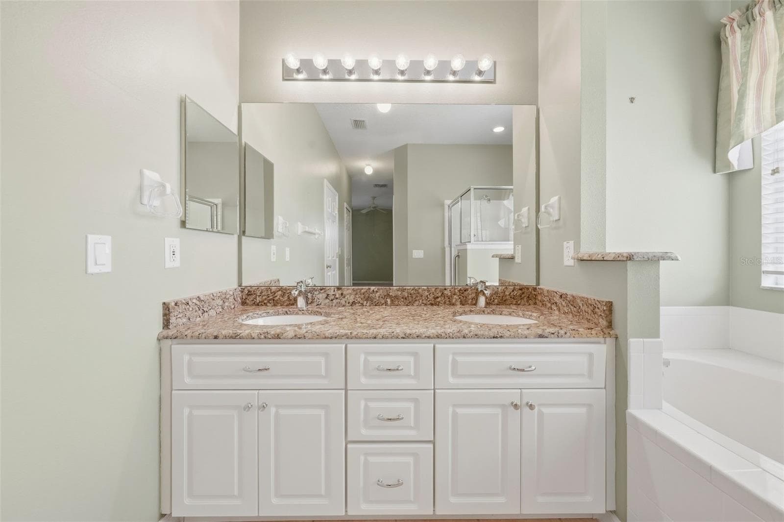 Double sinks and plenty of cabinets. - 5596 FREEPORT DR, TAVARES