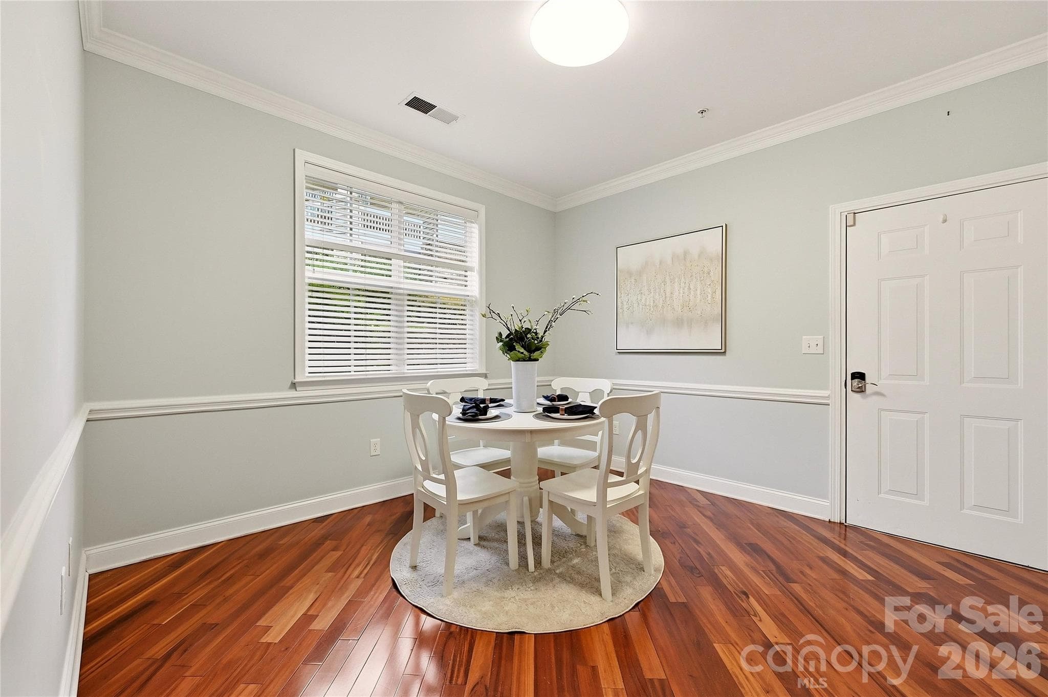 Additional dining area features hardwood flooring, natural light, and convenient access to the kitchen and main living spaces. - 9009 Rosalyn Glen Road, Cornelius
