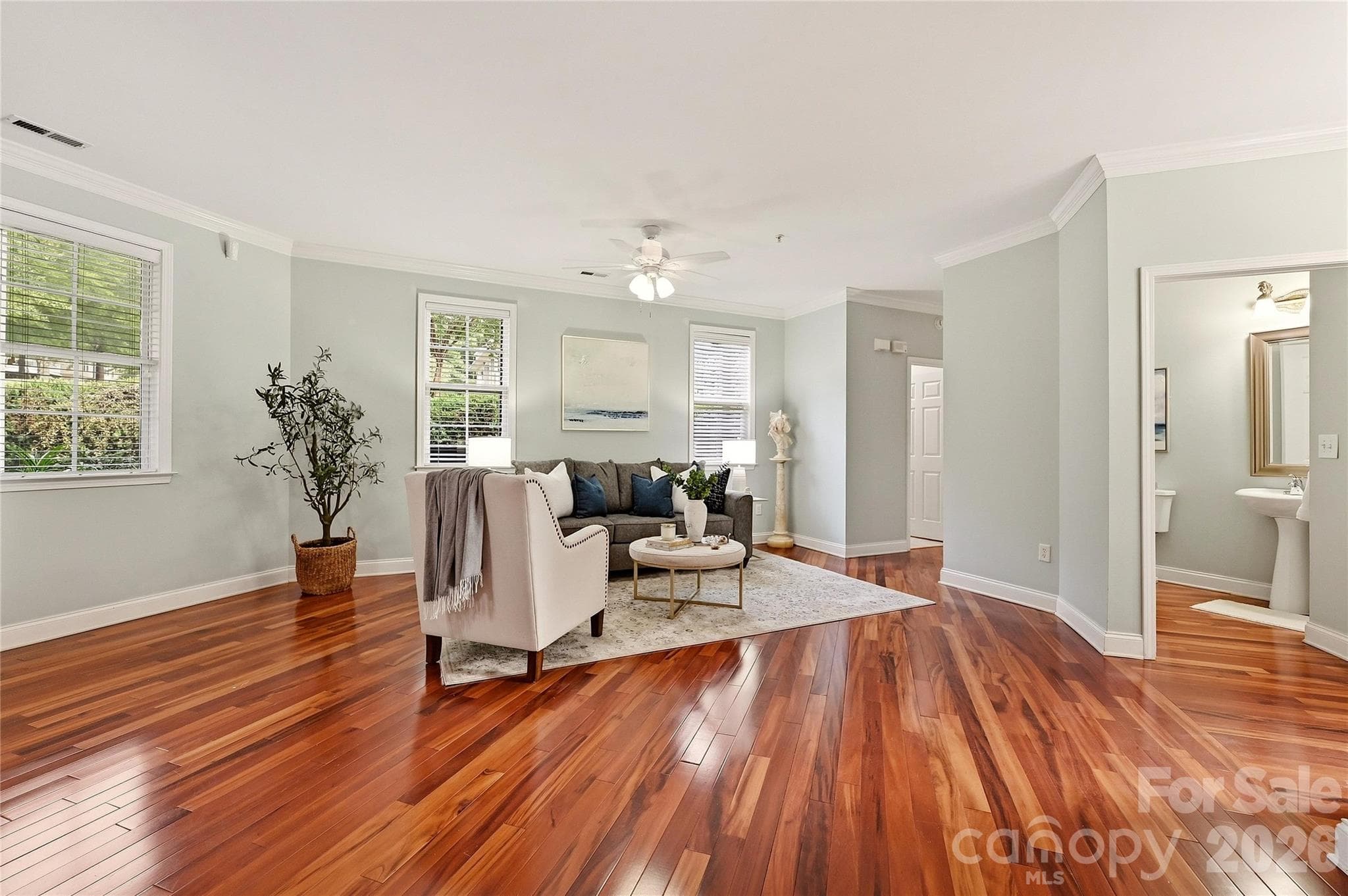 Open-concept living features hardwood floors and a flexible layout ideal for entertaining. - 9009 Rosalyn Glen Road, Cornelius